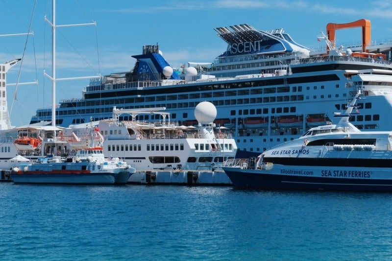 Vibrant cruise ships docked at a sunny port, ideal for travel and vacation themes.